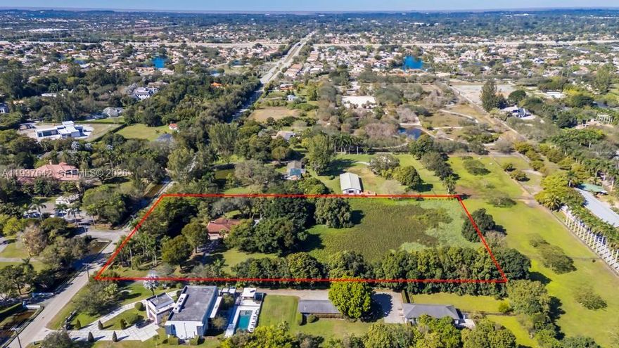 LAND, LAND, LAND! Exceptional opportunity to own an expansive 4.58-acre parcel featuring a serene, picturesque pond, offering the perfect canvas to design and build the estate home of your dreams. Located in the highly desirable and affluent community of Sunshine Ranches, this property provides a rare combination of privacy, space, and prestige in a low-density, equestrian-friendly setting. The existing residence on the property is being sold AS-IS, WHERE-IS, offering flexibility for renovation or future redevelopment. Surrounded by luxury estates, this property delivers endless potential for a custom home, guest house, stables, or private retreat. Enjoy a prime central location with easy access to top-rated schools, shopping, dining, and major highways, while still maintaining a peaceful, country-like atmosphere. A truly rare offering and an incredible opportunity to create a one-of-a-kind estate in one of South Florida’s most sought-after communities.