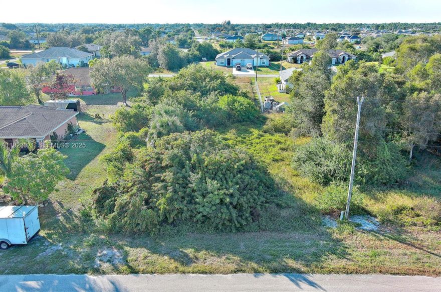 Discover the perfect spot to build your Florida dream home on this 0.25-acre vacant lot in a rapidly growing area of Lehigh Acres. Enjoy a quiet neighborhood with easy access to local shopping, schools, and major roadways. Ideal for investors, builders, or future homeowners looking for space and convenience. This property provides the ideal setting for a custom home, featuring plenty of space, a peaceful environment, and convenient proximity to parks, restaurants, shopping centers, and SR-82 for quick travel to Fort Myers and surrounding areas.