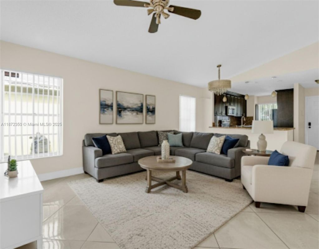 Photo of 5904 Woodland Point Pl, Tamarac, FL 33319 (MLS # A11872350)