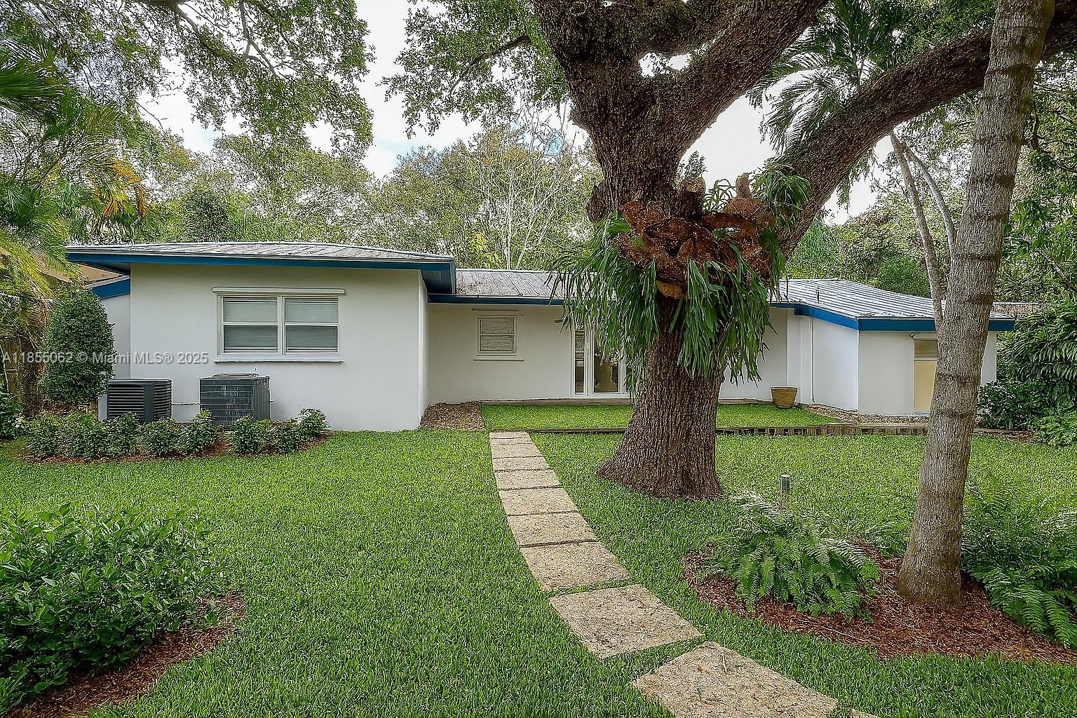 Experience the best of Coconut Grove in this fully renovated, gated single-family home. Enjoy an open layout with vaulted ceilings, walnut cabinets, new appliances, and polished floors filled with natural light. The property is fully enclosed by a concrete wall—perfect for pets—and features lush tropical landscaping, spacious bathrooms, full-size washer/dryer, and ample parking inside and outside the gate. The large private yard offers peace, privacy, and room to entertain. A rare rental opportunity in one of Miami’s most desirable neighborhoods