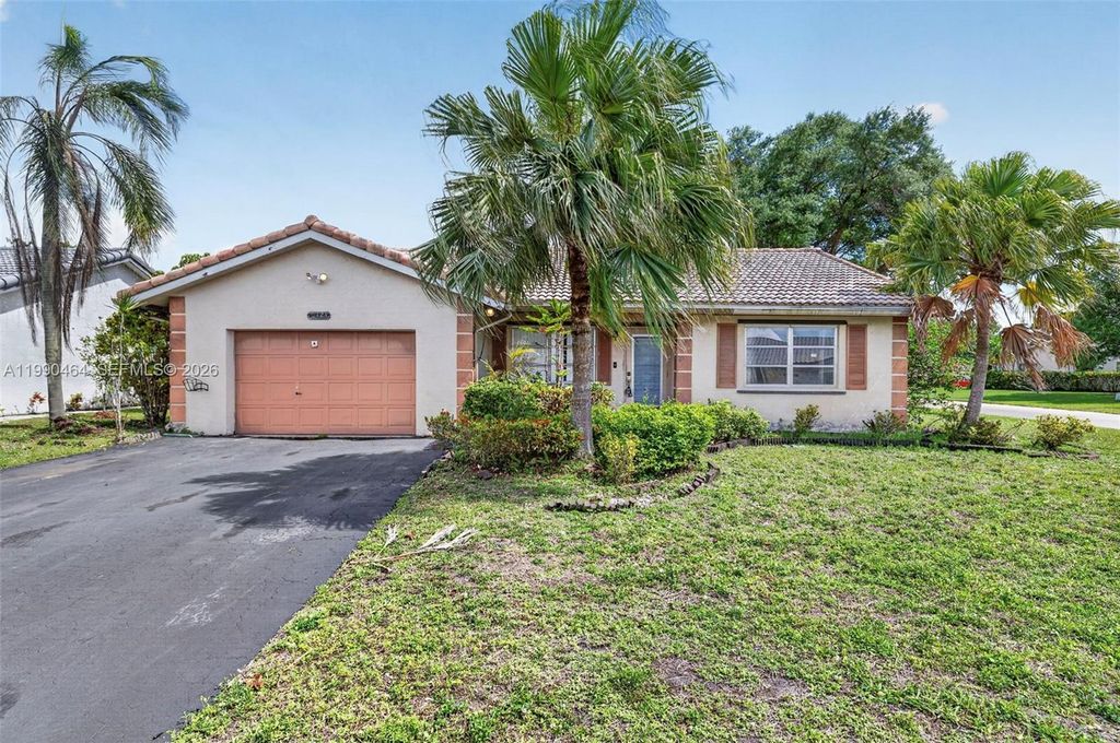 Photo of 10424 NW 70th Ct, Tamarac, FL 33321 (MLS # A11990464)
