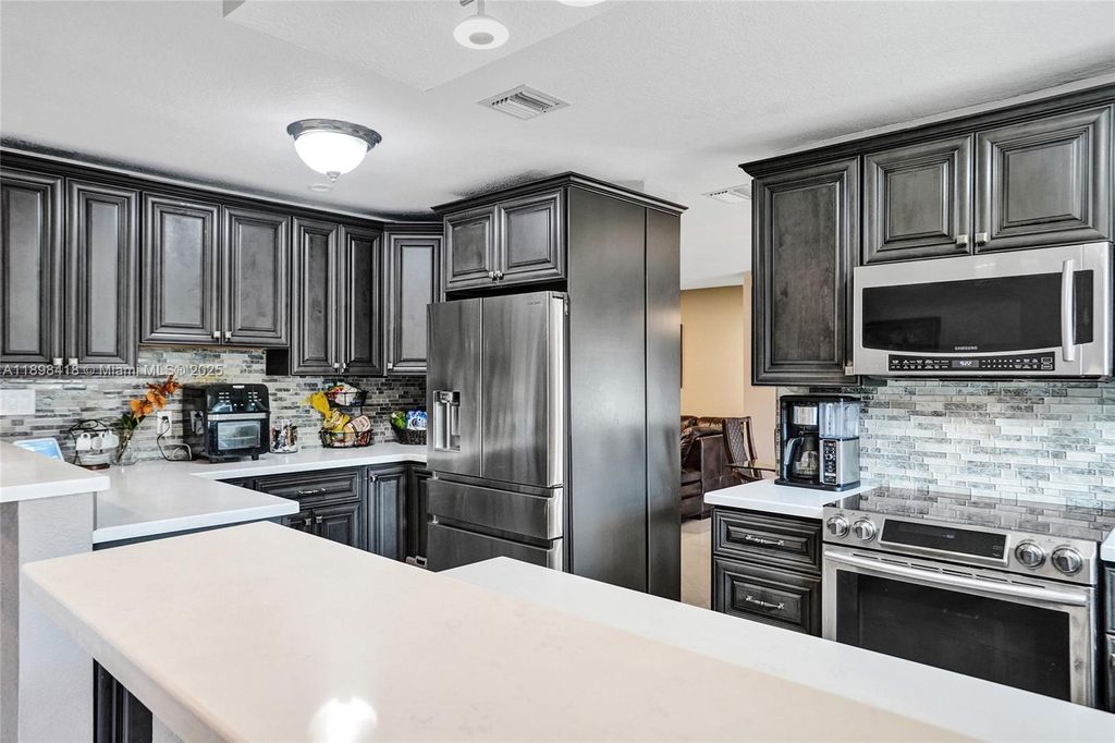 Photo of 9440 SW 49th Pl, Cooper City, FL 33328 (MLS # A11898418)