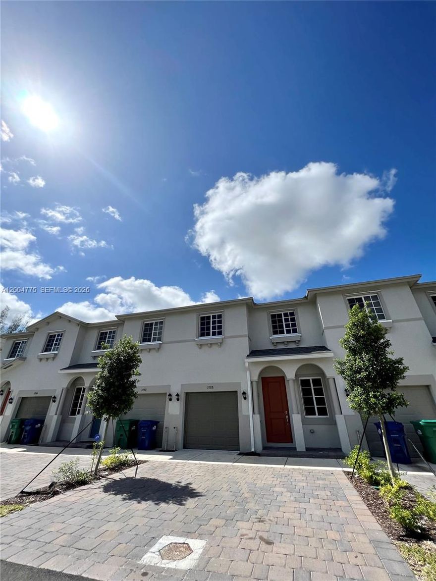 Beautiful and spacious 4-bedroom, 3-bathroom townhome located in the heart of Miami Gardens. This well-maintained residence features tile flooring on the first floor and carpet on the second floor for added comfort. Equipped with Smart Home connectivity, it offers modern convenience and functionality. Enjoy a generous living and dining area, along with a functional kitchen that opens to a cozy family room—perfect for everyday living and entertaining. Step outside to a large, fenced patio ideal for outdoor gatherings. Ceiling fans in all bedrooms enhance energy efficiency, and the property includes a washer and dryer. The home also offers a one-car garage plus two additional parking spaces in the driveway.
Ideally situated just minutes from major highways, including only a 4-minute drive to the Florida Turnpike, and close to schools, supermarkets, and shopping centers. Located in Walden Place, a newer community offering a family-friendly environment with amenities such as a kids playground, clubhouse, walkways, and green spaces. A perfect opportunity for comfortable and convenient living in a growing area.