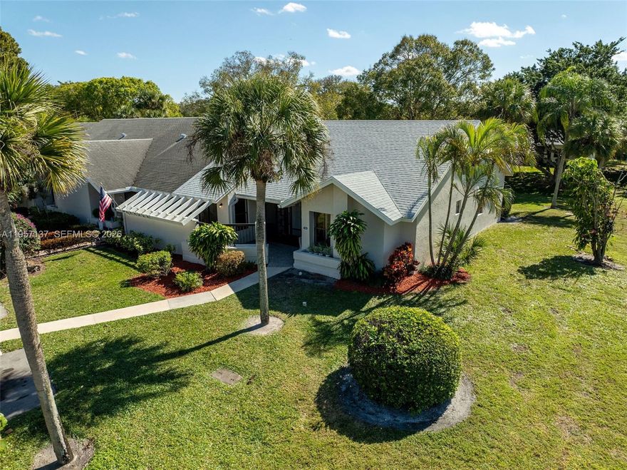 Completely remodeled  55+ Villa in West Boca! This gorgeous 2 Bed/ 2 Bath CORNER UNIT has a BRAND NEW ROOF, 2026, NEW NEUTRAL CERAMIC FLOORING in every room, NEW KITCHEN, tastefully redone with quartz counters and extra cabinet space for additional storage, and brand new appliances. Super spacious Living Room/Dining Room with vaulted ceilings and new recessed lighting. Both BATHROOMS ARE FULLY RENOVATED.  FRESHLY PAINTED. Expansive Florida Room , enclosed and under A/C, overlooking the canal, makes for a perfect space, ideal for your morning coffee, office area, entertaining and more. Washer and Dryer inside the unit. Lots of closet space in this unit, including walk in closet in primary room.  Low HOA fees! Clubhouse includes Pool, Sauna, Tennis Courts, Hot Tub, Gym, etc. Very close to Restaurants, the Beach, Mizner Park, Delray and more.