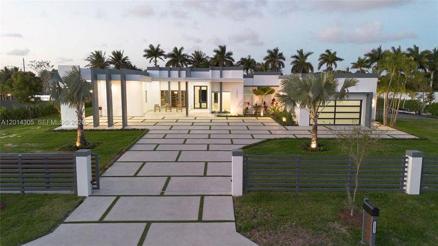 Made your dream home come true with your NEW CONSTRUCTION Modern Architectural design with 6,400 sq ft building and 1.05 ACRE LOT, generating spaces full Harmony located in the quietest and nice area. This house has 5 bedrooms/ 5 bathroom spa-style with two-person shower, Den-office room, luxury Kitchen with coffee station, open-concept living and dining room, laundry room with sink and built-ins, CONCRETE ROOF AND HIGH ELAVATION that help insurance premium, open carport, 2 car garage with 725 sq ft including storage room, PLUS 4,000 SQ FT CONCRETE DRIVE-WAY Outdoor amenities include a pool, covered terrace with 1,200 sq ft, FULL outdoor kitchen equipped with all you need dishwasher/microwave and other, gazebo to relax perfect to enjoy tropical view with your fruits gardens with sprinkler system, custom made fire place. Full fence with rear canal. Enough space for your Boat, Rv or any others.