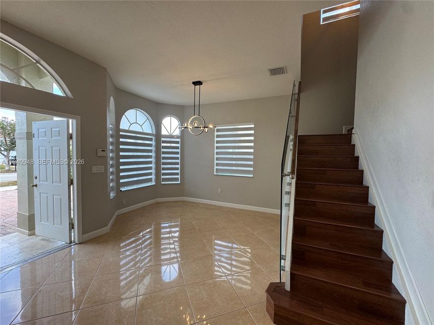 Beautiful modern 2 story 5 bedroom 3 bath home in very quiet area of area. Spacious and open living areas, and bedrooms, tile floors, great open kitchen with stainless steel appliances, laundry room upstair, double garage. Fenced backyard with awning and room for pool. No association fees Close to main expressways, shopping and restaurants