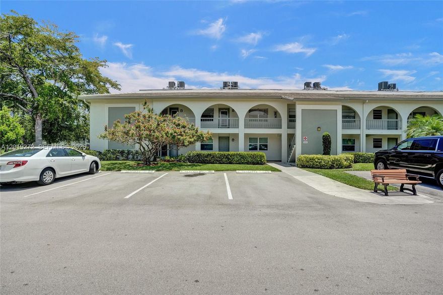 Beautifully updated 2 bed, 2 bath first-floor condo in Bahama Village at Wynmoor! Featuring impact windows (2019) and stylish laminate flooring throughout. The remodeled kitchen (2022) boasts stainless steel appliances, modern cabinetry, and quartz countertops with generous counter space—perfect for everyday living and entertaining. Enjoy a newer A/C (2020) and water heater (2018) for year-round efficiency. The split-bedroom layout provides privacy. Step outside to a serene garden-view screened patio - Steps to the Village pool. Located in Wynmoor’s vibrant 55+ community with resort-style amenities—pools, golf, tennis, fitness center, theater, and more. This unit is perfectly located near the guarded entry gate and main amenities. Truly a must-see!