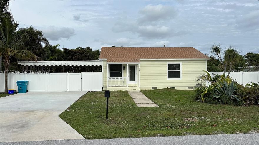 UPDATED IN 2022 SINGLE-FAMILY HOME ON OVER 1/4 ACRE LOT, HUGE DRIVEWAY AND COVERED PATIO WITH NO HOA. TWO BEDROOMS AND TWO UPDATED BATHS AND LARGE FENCED-IN YARD FOR STORING YOUR BOAT OR RV. KITCHEN FEATURES WHITE CABINETRY QUARTZ COUNTERTOPS AND STAINLESS APPLIANCES. IMPACT WINDOWS EXCELLENT LOCATION - WALK TO MARINA - TWO MILES TO NEAREST BEACH. EASY ACCESS TO HIGHWAYS SHOPPING TRANSPORTATION ENTERTAINMENT AND DINING. LANDRY ROOM THAT HAS WASHER / DRYER HOOKUPS AND TANKLESS HOT WATER HEATER