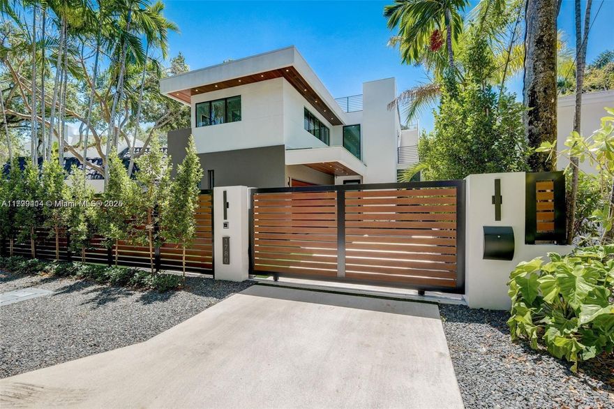 Unique opportunity to own this beautiful and modern home in one of the most private and secluded cul de sac in North Grove. It offers 12' ceilings with an elevator. 5 bedrooms and 4 bathrooms. 2-car-Attached garage. One bedroom is downstairs including a cabana bath. The kitchen is an epicurean delight with a large cooking island, Sub Zero, Wolfe, and Miele Appliances. Salt-water pool & color LED lights, 10' impact windows, wood floors, security cameras & custom lighting. It also includes a beautiful 868 sqft rooftop. The location is prime with great proximity to shopping & dining such as fresh market, Peacock park, Monty's raw bar and more.