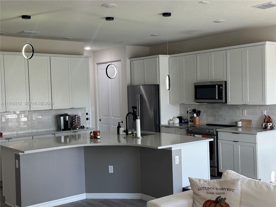 Look No Further! This amazing townhouse boast 3 beds, 2.5 baths. Built in 2022 and Nestled in the sought-after Oak Tree community. Prepare to be enchanted by the breathtaking lake views, offering a sense of tranquility that will soothe your soul. Embrace sustainability and luxury with eco-friendly features like solar panels and water filtration. Updated kitchen with stainless steel appliances and a spacious island great for gatherings. Enjoy the convenience of a smart home system equipped with nest thermostat and ring cameras, Internet is including in the HOA. All impact windows and doors for your security. Lots of storage a two car garage. Enjoy a million dollar clubhouse with state of the art gym, stunning pool, pickleball and more. Don't miss this opportunity! THIS IS A MUST SEE!