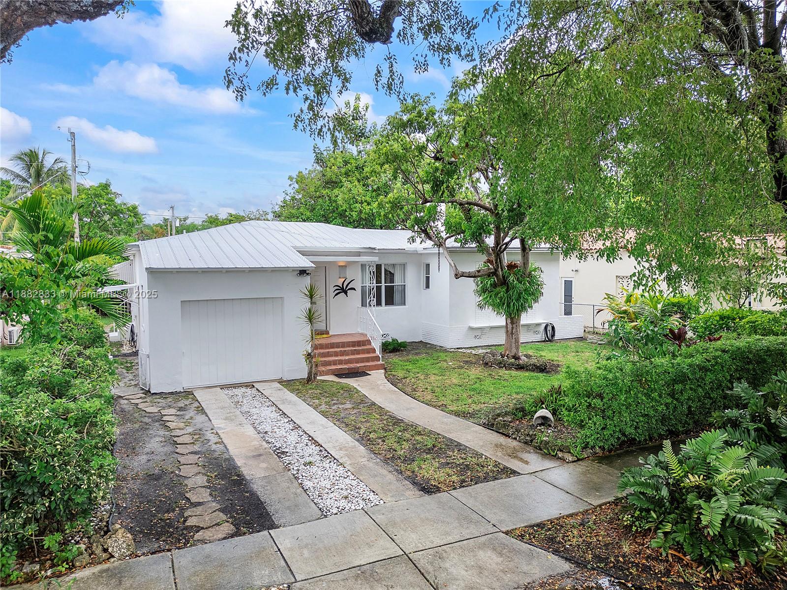 Amazing location! Lovely and well cared for immaculate home in the sought-after Shenandoah neighborhood known for it's tree-lined streets and welcoming community! Extremely convenient central location for public transportation and walk to Shenandoah Park on SW 21st Ave which has swimming facilities, playground, basketball & tennis courts. You will find charm and character in this well constructed home with a metal roof and solar panels, fireplace, two generous size bedrooms & two baths and a full one car garage, plenty of room to add a pool if desired, an excellent opportunity to customize the space to your preferences and create a great investment property at the same time! Additional storage shed in the backyard and a big avocado tree!! Bring your best offer & make it yours today!