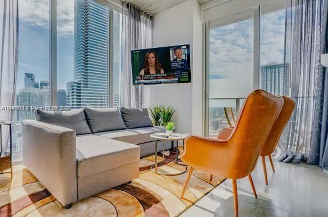 Enjoy this spectacular furnished luxury condo with 2 beds and 2 full baths with Miami Skyline views, high ceilings and spectacular amenities. it's walking distance from Brickell and the best places in Downtown Miami, full amenities like a gym, spe, social rooms, and a rooftop pool with incredible 360° views of the bay and city!. Valet parking at the building door or parking across the street!