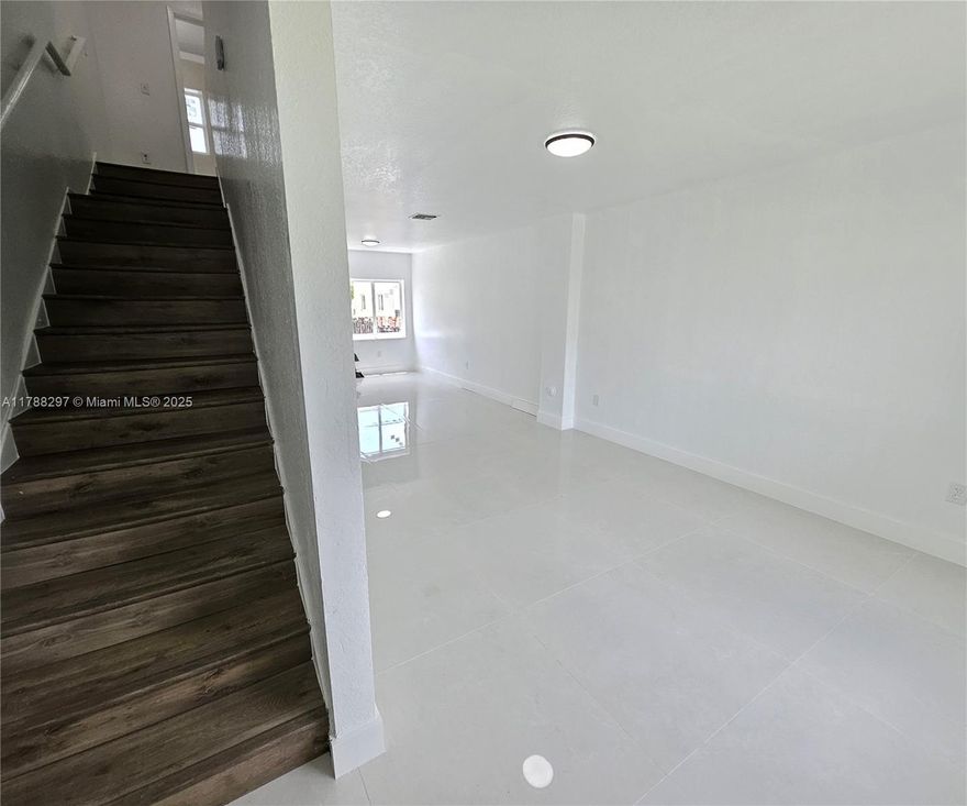 ///BACK IN THE MARKET, FINANCING FELL THROUGH/// Beautifully remodeled townhouse, painted throughout, new light fixtures, with brand-new porcelain floors, kitchen, bathrooms, brand new central A/C with warranty, and hurricane-impact windows. Washer and dryer in the unit, private fenced patio, and plenty of parking. Low HOA fee. Located near Aventura, Gulfstream, and the beaches. Association allows rentals from day one and all ages are welcome, making it an excellent investment opportunity. Market rent is approximately $2,500/month. The unit is vacant and ready for immediate move-in or rental. Don’t miss this turnkey opportunity in a high-demand area. VIDEO VIRTUAL TOUR AVAILABLE UPON REQUEST. See Broker Remarks.