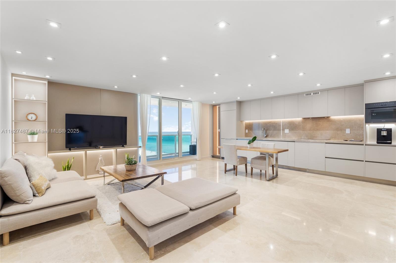 New From Top to Bottom! Sophisticated, chic, & move-in ready — this newly gut-renovated residence is essentially brand new. Enjoy panoramic northeast views of the Atlantic Ocean and the iconic 1 Hotel center pool. Offering 1,391 SF of refined living space, the layout features 2 BD, a den/office/guest area, & 3 full baths. The elegant kitchen offers Miele appliances, a wine display, pantry, & in-unit washer/dryer. Spa-like baths boast travertine floors, fluted marble, double vanities, soaking tub, & a lighted walk-in closet. 2 valet parking & access to 1 Hotel’s world-class amenities: 600ft of oceanfront, multiple pools, & more! (Resort License already in place). 1011 & 1012 were thoughtfully combined to create this one-of-a-kind turnkey unit. Earn Money While Away! 30-Day Rentals Allowed!