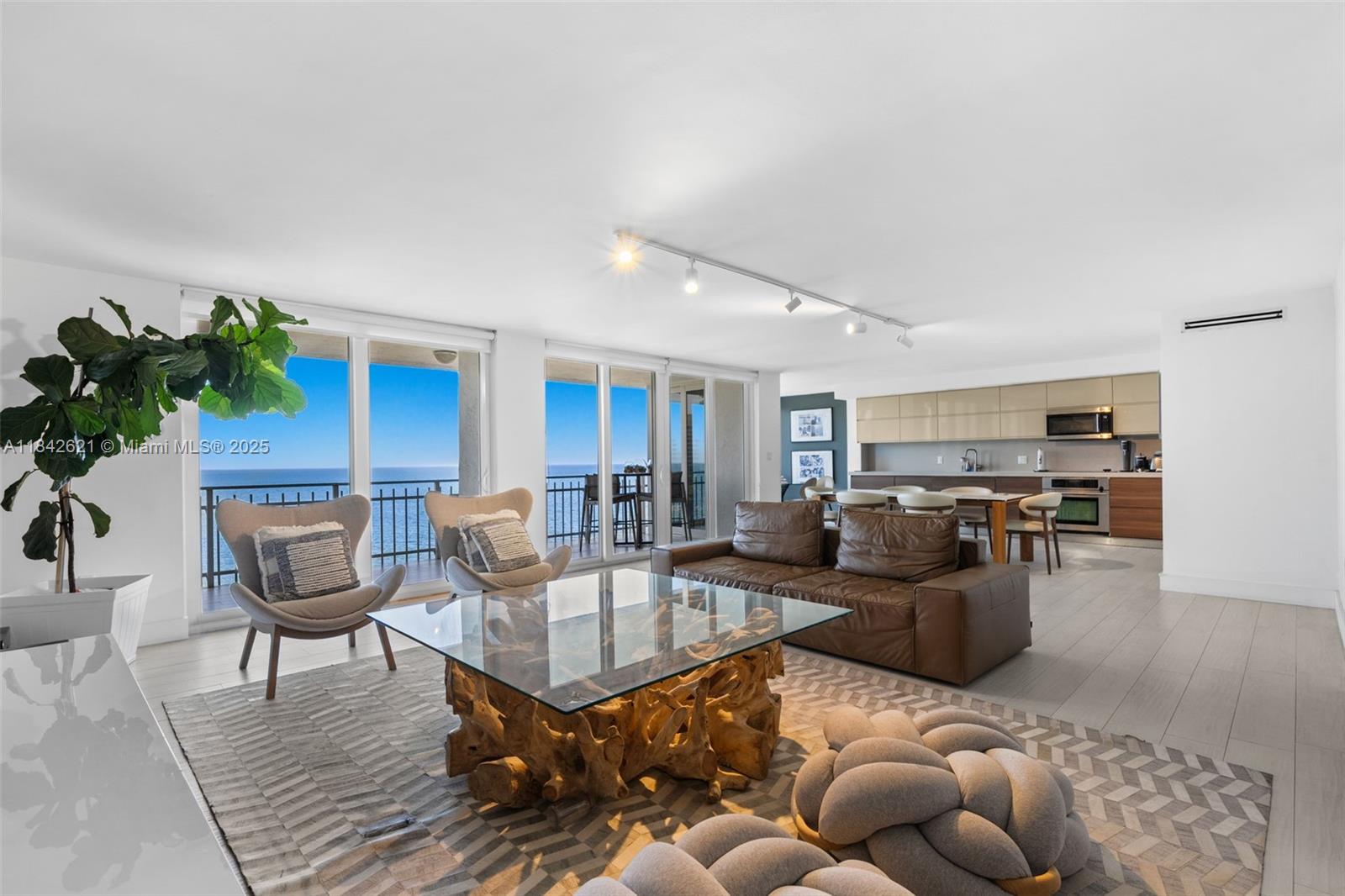 Direct ocean view! Enjoy waterfront living in this beautifully remodeled three-bedroom, three-bathroom apartment. The home features elegant tile flooring throughout, a custom-designed kitchen with top-of-the-line appliances, and modern bath cabinets. Enjoy peace of mind with impact windows and doors, a separate laundry area, and spacious bathrooms with ample closet space. The large eat-in kitchen and oversized terrace make this home perfect for entertaining guests in style. The building offers resort-style amenities, including private beach access, pool, BBQ, gym and a penthouse party room with panoramic ocean views.