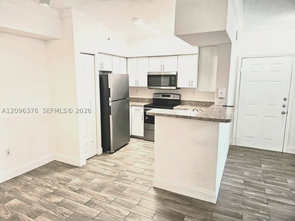 Photo of 220 SW 116th Ave #15105, Pembroke Pines, FL 33025 (MLS # A12096378)