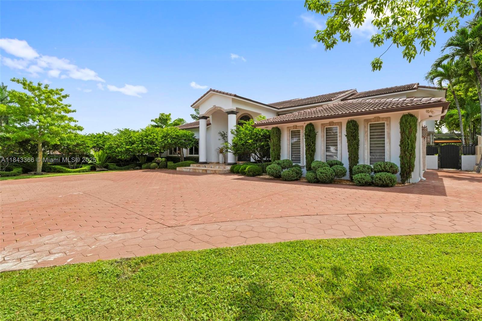 Stunning two-story estate in Miami on nearly an acre, featuring a European-style main house and a modern guest house. It offers 6 BRs, 7 BAs over 6,400 sq ft of living space, and a total area exceeding 8,500 sq ft. The chef’s kitchen highlights custom wood cabinetry, built-in appliances, and granite countertops. The bright dining area has a view of lush gardens, while a game room leads to a remodeled modern pool and outdoor entertaining space. The main living room has a vaulted ceiling with ambient lighting. The detached guest house features its own kitchen, private balcony, and entrance, making it an ideal accommodation for families or visitors. With mature landscaping, ample driveway space, and privacy, this turnkey property offers luxury and versatility. Don’t miss this opportunity!