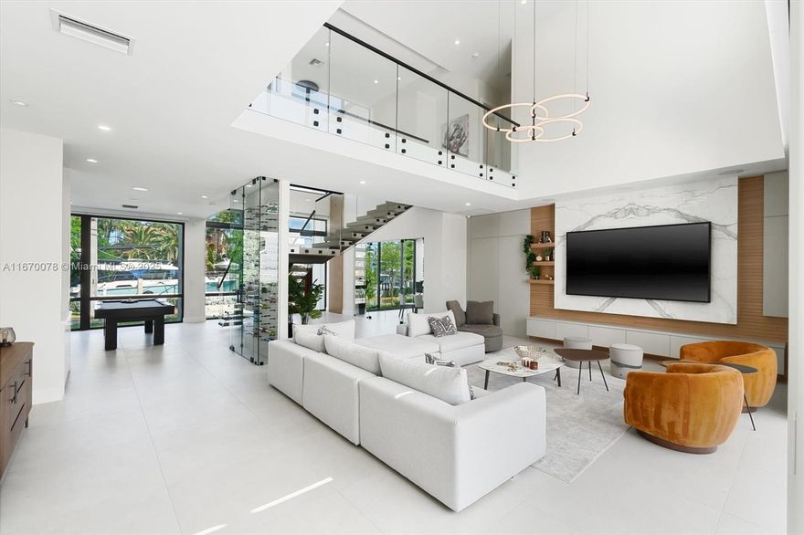 Brand-new residence with stunning waterway views, new dockage, no fixed bridges, and quick access to the Intracoastal and ocean. Modern design, open floor plan, expansive windows, floating glass stairs, wine storage, and wet bar. Living room with double-height ceilings. Gourmet kitchen with Thermador appliances, large island, and ample counter space. First-floor office/or 5th bedroom. Primary suite features two huge walk-in closets and spa-like bath. Three additional bedrooms, all with en-suite baths. Features a second-floor laundry, generator, complete Control 4 automation, and summer kitchen. Tropical backyard with waterfall pool, heated/cooled saltwater, and sun shelf. Three car garage + 3 driveway spaces. Located minutes to downtown Fort Lauderdale, Las Olas and beaches.