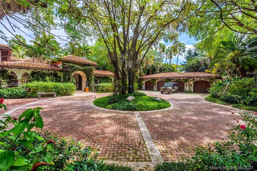 This Mediterranean Estate features 175' of direct waterfront overlooking scenic Indian Creek ideally situated on a rarely offered 1.1 acre lot double lot. This meticulously remodeled & expanded 1937 estate features state-of-the-art technological integration & boasts 9BR/11+2BA, a 22,000 gallon pool, pool cabana, koi pond, sculptured gardens, gym, spa, glam room with hair salon, wine cellar, library, safe room. 2 BD guest house, 2 guest apts, and a 100 foot private dock with a boat lift and a 3 jet ski lift. 4 Car Garage + 2 Car Garage.