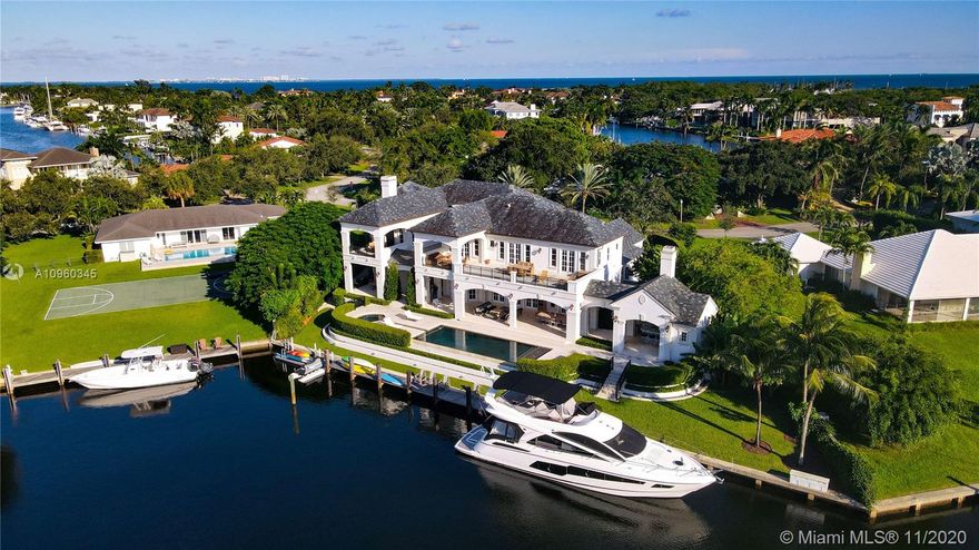 Lagoon views wrap around this stunning residence in the highly coveted & gated Coral Gables Community of Old Cutler Bay. Updated in 2015, this masterpiece boasts an oversize foyer with volume ceilings and abundant natural light. The Chef's kitchen, with top of the line appliances is a culinary delight. Formal dining room and covered  terraces are ideal for entertaining inside or outside overlooking the infinity edge pool. Luxurious master suite w fireplace & oversize Master Bath. In home theater, 4 car garage, full home generator, 2 guest suites and 100' private dock w direct ocean access complete this magnificent estate. Elegant symmetry reigns in what is the epitome of lifestyle and location.