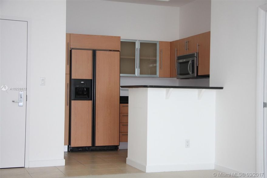 Lower Penthouse with beautiful views of Biscayne Bay and Downtown Miami. Unit is currently rented. High ceilings throughout. North / Northeast view from balcony and west view (down the Miami River) from guest bedroom.