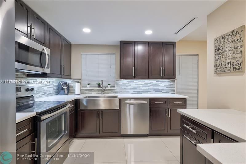 FOR SALE: SPACIOUS 3-BEDROOM, 2-BATHROOM UNIT featuring a MASTER BEDROOM with WALK-IN CLOSET, an OPEN LAYOUT, and stunning CANAL VIEWS from your PRIVATE DECK. Enjoy the convenience of a NEW WASHER AND DRYER in a FRESHLY PAINTED BUILDING EXTERIOR. Additional highlights include PERSONAL STORAGE, SEPARATE BIKE STORAGE, and ASSIGNED PARKING. Community amenities include WATER, GARBAGE REMOVAL, POOL MAINTENANCE, LANDSCAPING, and MASTER INSURANCE covering the BUILDING EXTERIOR and ROOFS. Located in a TOP-RATED SCHOOL DISTRICT, this unit offers a HASSLE-FREE LIFESTYLE in a HIGHLY DESIRABLE COMPLEX and PRIME LOCATION.