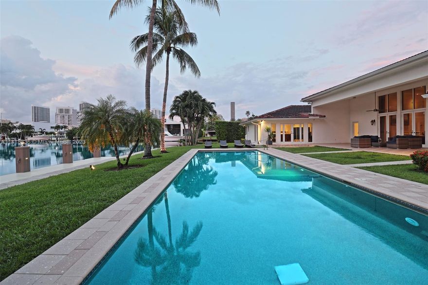 Luxury waterfront property for boat lovers in exclusive Golden Isles gated community. Oversized 19,235 SQFT POINT LOT with 250+ FT of waterfront, perfect for 2 large Yachts 110+ FT. A 6,251 total SQFT ONE STORY HOUSE with 6 Bedrooms, 6 1/2 Bathrooms w/Sauna system. High ceilings in Living room, Dining, Bar, & studio area. Spacious family room with Italian Kitchen with MIELE appliances, direct gas line connected to stove, water heater. 2nd largest pool in Golden Isles 50FTx15FT with saltwater heated system, swimming jets, & Heyward System. Covered LARGE terrace suitable for gatherings. 2 indoor car garages, circular driveway. Impact windows, walk-in closets, security system, surround sound. Stunning water views. 2009 CITY GOLD AWARD FOR OUTSTANDING IMPROVEMENTS AND BEAUTIFICATION.