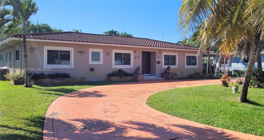 Welcome to your Spanish Villa centrally located near Downtown Hollywood in Hollywood Little Ranches. This beautifully remodeled modern home has a bevy of key features with great attention to detail including incredible flooring with porcelain tiles in the living areas, exquisite Bamboo room flooring in the rooms, stunning panoramic impact windows, built in Sonos premium sound system throughtout and a Aquakleen water system. You'll love the smart design of the custom kitchen with top shelf smart stainless steel appliances, wine cooler, and specially fabricated custom cabinetry. Enjoy your resort style backyard with a 20,000 sf lot that includes a Hawaiian style Tiki, a tropical lanai with a lap size saltwater pool, entertaining ready screened patio and a huge storage room for even more storage. In addition to the 2466 sf of interior space which encompasses spaciious 4 bedrooms & 3.5 baths.  The gorgeous terracotta circular driveway makes for an impressive entrance and it has a garage and a  carport for additional vehicles as well. The new AC, water heater and roof will give you years of peace of mind. This is where you want to be with only a few minutes to Hollywood Beach and Hollywood's arts/entertainment district is just steps away.