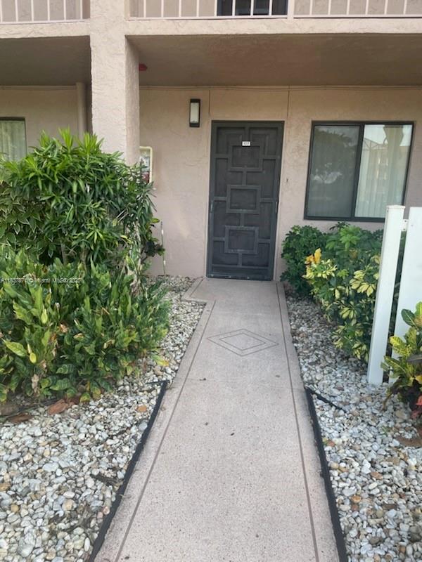 Beautiful long lake views and sunsets from this spacious and bright first floor condo! 2 bedrooms 2 baths. Large master bedroom with sitting or office area with access to patio. Air conditioner 2019. Huntington Lakes newly renovated clubhouse includes 600+ seat theater, ballroom, fitness center, card rooms, library and so much more! Indoor pool, tennis, pickleball. Tree lined walking paths. 24 hour guard gated community.