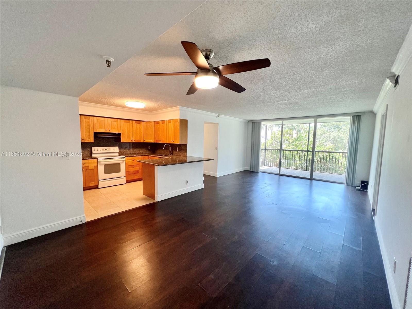 Welcome to Boca living at its best! This beautifully maintained 3-bed, 2-bath condo in Boca Teeca offers 1,370 sqft with a split layout, tile/wood floors, and a screened balcony overlooking the pool and gardens. Accordion shutters throughout. The open kitchen features bar seating, full-size appliances, and ample storage. Primary suite includes walk-in closet, vanity, tub & shower. In-unit washer/dryer. 1 Assigned Front VIP Parking + guest spots. Enjoy pool, clubhouse, tennis, pickleball, and more. Minutes to I-95, FAU, Whole Foods, Mizner Park, beaches & A-rated schools. Water, cable, internet included. Professionally cleaned and move-in ready. Quiet, walkable community with fast HOA approval. Don’t miss this rare opportunity in one of Boca’s most convenient and amenity-rich neighborhoods.