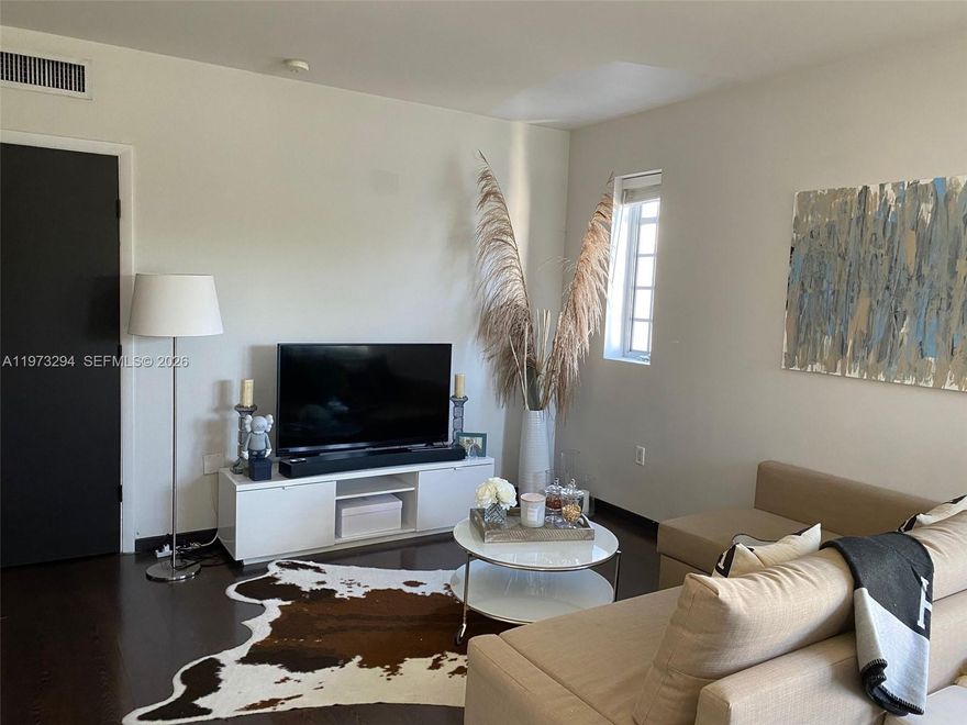 This spacious corner unit features abundant natural light, offering both comfort and style. It includes one valet parking space, beach service, and an in-unit washer and dryer. Take advantage of the building’s heated pool and state-of-the-art fitness center, all just one block from the beach and a short stroll to Lincoln Road Mall.