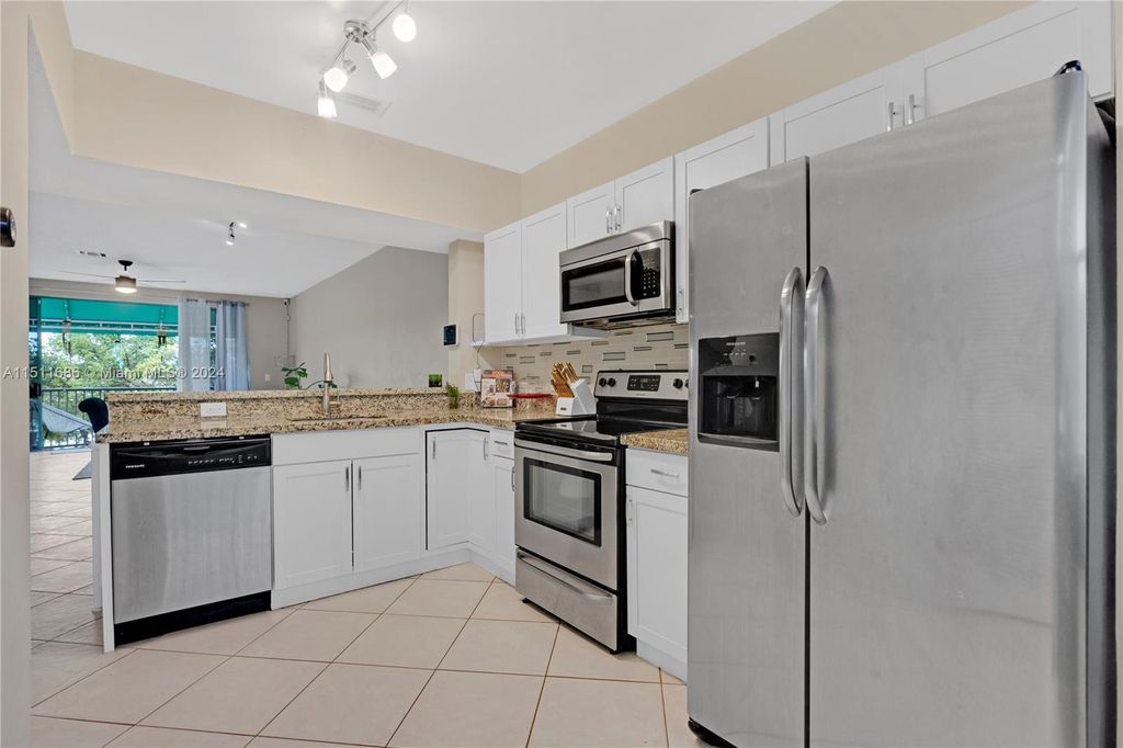 Photo of 1365 NW 126th Way #1365, Sunrise, FL 33323 (MLS # A11511686)