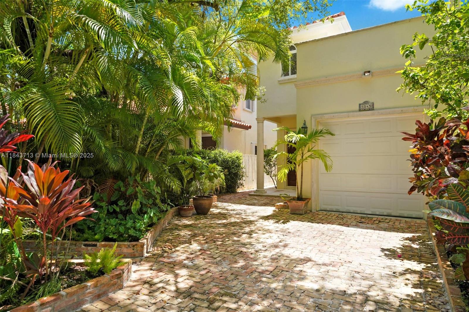 Meticulously maintained townhouse located on one of Coconut Grove’s most coveted streets—Allamanda! This gated residence is just steps from Blanche Park, offering the best children’s and dog parks in the Grove. The interior features travertine and pine wood floors, a gourmet kitchen, and a spacious great room that opens to a lush tropical oasis with a swimming pool and covered veranda—ideal for alfresco dining and entertaining. Custom-built-in bookshelves enhance the expansive living and dining areas. The luxurious primary suite includes a spacious office nook and an outdoor terrace perfect for morning coffee. Additional highlights include impact windows and doors, a one-car garage, ample storage, all gated. Walk to parks, cafés, marinas, and all the Village of Coconut Grove has to offer!