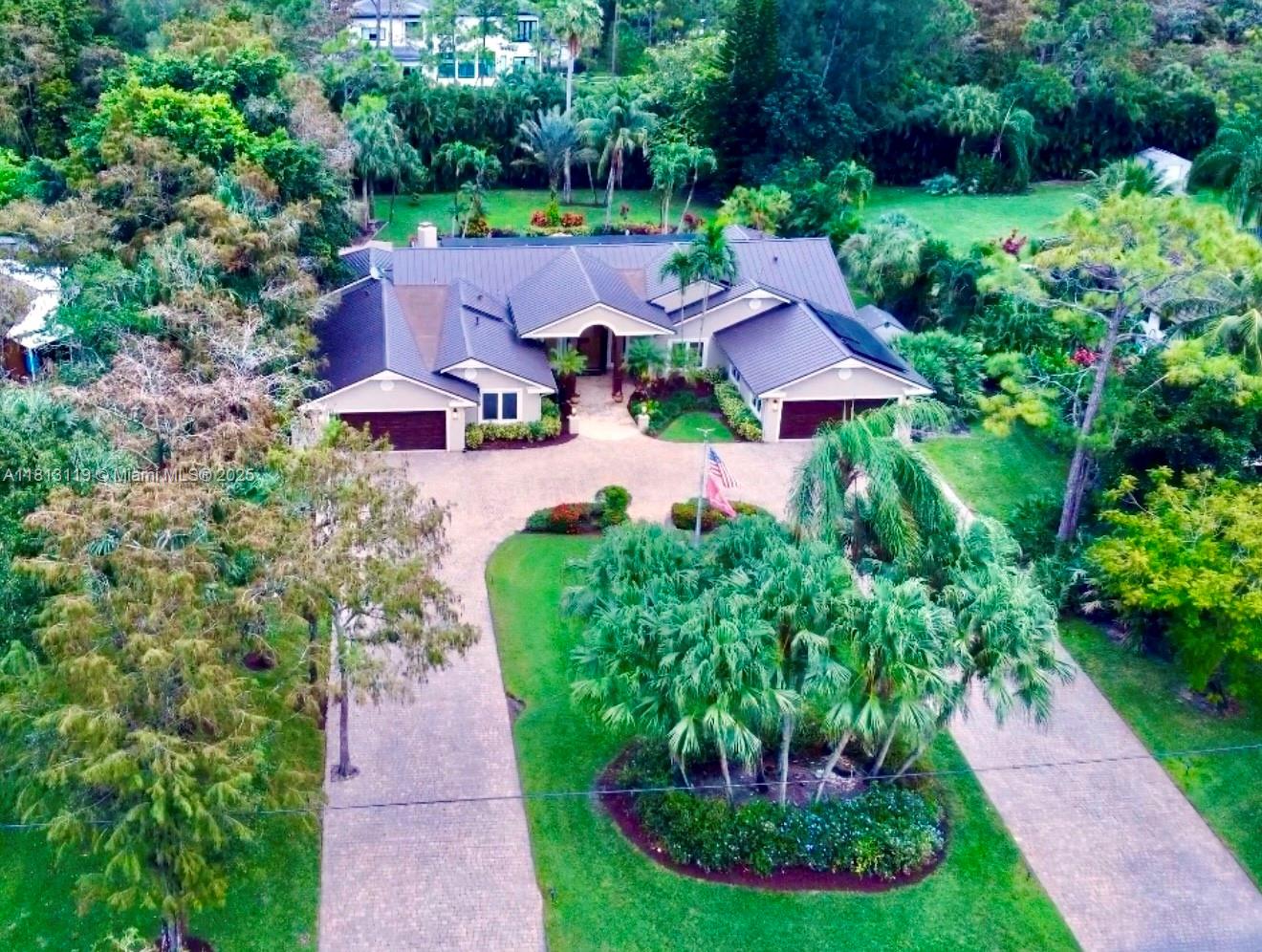 Entertainer Private Estate 5BD/5BA One story on 1.09 acres at the end of a quiet cul-de-sac NO HOA! Movie Theater, Vaulted Ceilings, Chef's gas kitchen, Luxury Cocktail Bar, Wine Hallway, Fireplace, Marble floors, EV charger, NO Restrictions! Grand Entry View of lagoon resort pool, waterfalls, jacuzzi, New Outdoor Luxury Kitchen, Custom Cabinetry & Open Private Yard. Over $600K in upgrades: 2020 Metal Roof, NEW Solar Panels (avg.$50/month electric) New Impact Windows/Doors, Smart Home (Pro Cloud Gateway support 100+ devices) Sonos, Osmosis Filtration, Central Vacuum, 45 KW Whole House Generator, 24hr Security System, Bidet, RV/boat hookups, Climate Controlled Garage, Pet Electric Perimeter Fence. Massive Driveway 20+cars! A rated schools by Equestrian Center, Fire station & restaurants.