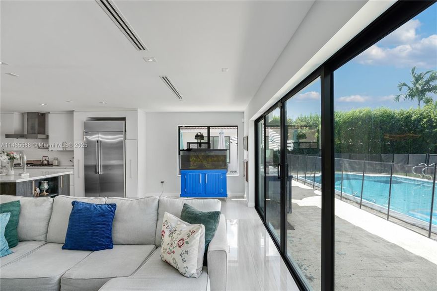 Beautiful Contemporary home situated on a huge 13,875 sqft waterfront lot in Historic Griffing Park Estates right next door to Biscayne Park. This home sits on beautiful canal and has 3 bedrooms / 2.5 bathrooms  Home was completely remodeled with high end finishes in the last few years with all designer finishes. Features of the home include tiled floor throughout, impact windows and doors, expansive living areas, remodeled open chef’s kitchen with gas cooktop, 2 fireplaces, large laundry room, a huge master bed/bath, and 2 car garage. Backyard includes a beautiful pool and owner has approved plans for a detached pool house and utilities are in place for an outdoor kitchen. This home has it all and is a MUST SEE!!