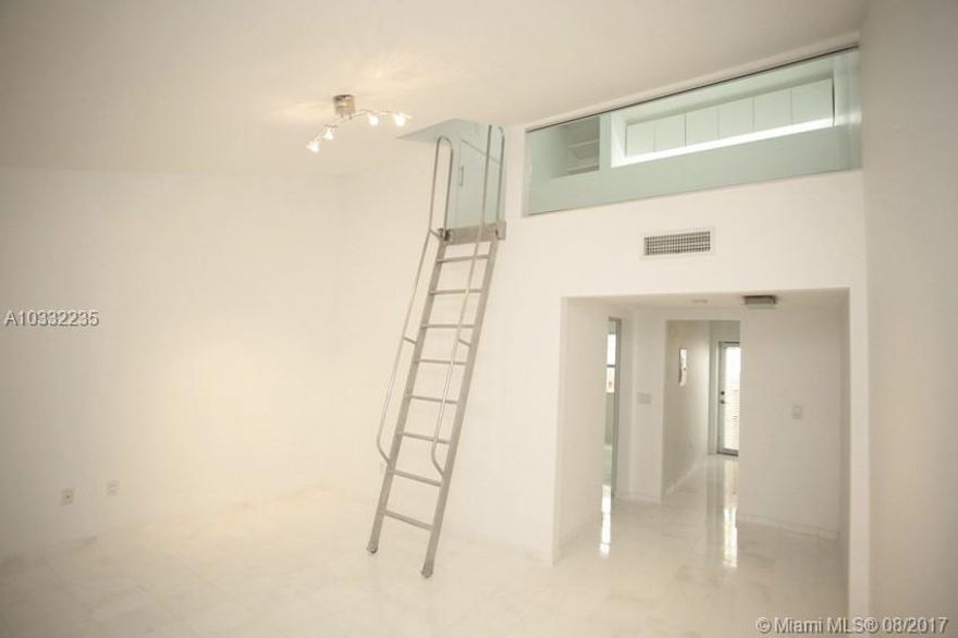 Bacarat lofts is a 1 story loft building redone inside and out. The loft area could be used like a 2nd guest bedroom though best used as an office area. White marble floors and a white lacquered modern kitchen with stainless steel appliances and dishwasher. There is a separate bedroom and a washer/dryer inside the unit. Frosted glass doors in bedroom and bathroom. Newly purchased central A/C. Residential street parking via residential permit. Pets allowed on a case by case basis.
Tenant responsible for Electric. Unit is available partially furnished or unfurnished. 1 Bedroom + loft space. Tenant shall pay $50 processing fee to Global Luxury Realty LLC