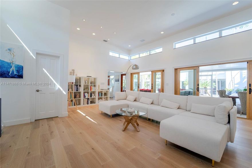 This immaculate contemporary resort-style home sits on a deep acre lot in the heart of Pinecrest. It is located in a low traffic street and was completely remodeled and updated by renowned architect David Johnson. One of Pinecrest's few large one-story homes, it has 12ft high ceilings throughout most of the house.The 6 bedroom plus large and bright office space home is perfect for work and entertainment, with a full range of amenities including a professionally designed movie theater, a basketball court, a volleyball court, a dedicated ping pong area, a large pool, an oversized tree house and multiple outdoor sitting areas for alfresco living and dining. A true family paradise!