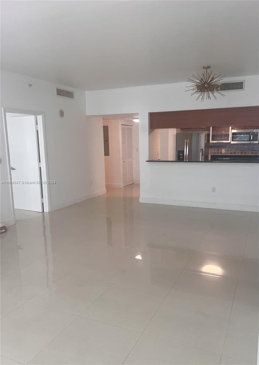 Pristine two bedroom condo in a beautifully maintained bay front high rise condo in Edgewater. With the spectacular Margaret Pace Park at your door step, coffee shops & restaurants. This building boasts a wide array of water view amenities including a gym. Relaxing pool area as well as many other spaces to relax, socialize, work and entertain. This two bedroom unit has a spacious balcony that provides a serene water and park view. Split design with 2 large bedrooms with 3 walk in closets & a spacious living/dining area. The assigned space is conveniently on the same floor as the unit and just one level below the pool and fitness area. Making access to and from the unit stress free. Friendly and professional onsite management. Priced to sell and ready to move in!