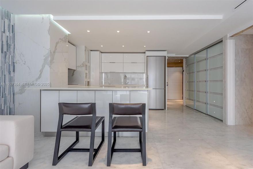 Totally remodeled designer unit. Marble floors throughout with open kitchen, living area. Full size washer/dryer in unit. Master bedroom has in suite master bath with tub, shower and bidet. 2nd bedroom/den does not have a window but has a closet and full bathroom. Breathtaking views of the ocean from your balcony. Amenities include front desk attendant, gym, covered parking, valet, sauna, pool, and direct beach access.