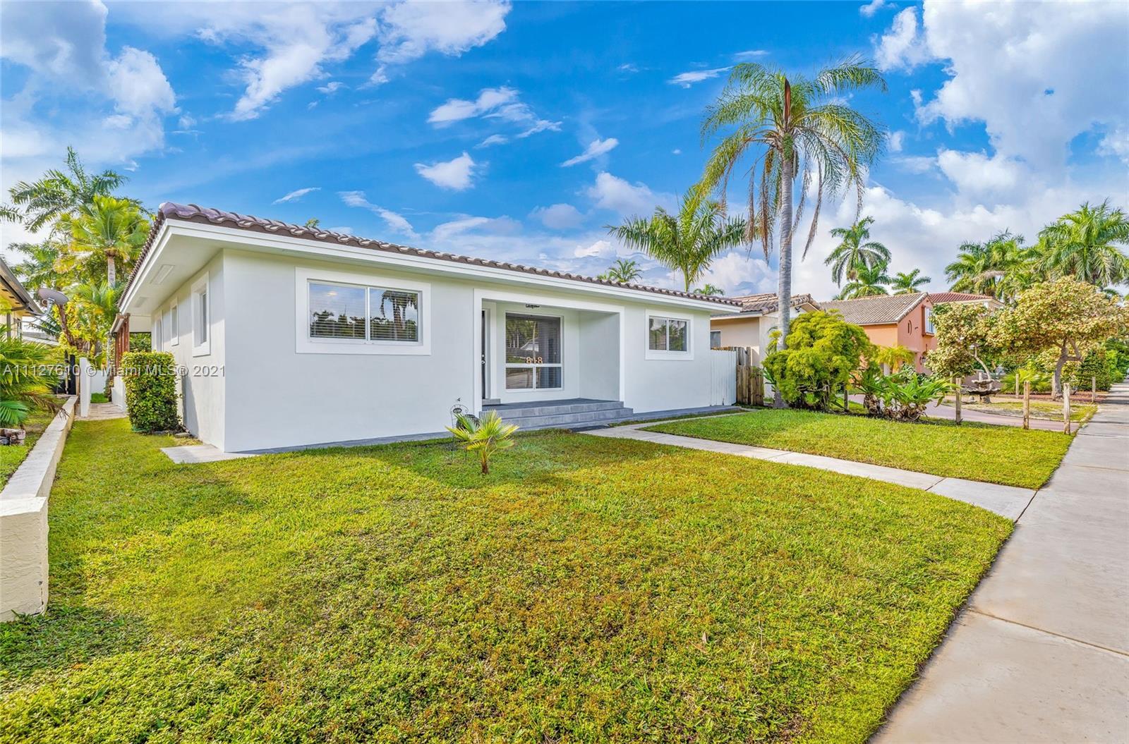 Five minutes walking to the beach, this beautiful remodeled 4 bedroom home has been designed to the highest standard. Step into this cozy abode full of light and make it a home for you and your family. Perfect for working, living, and entertaining inside and outside on the patio. New baths and appliances, porcelain white tile floors throughout. The spacious kitchen and wine fridge add a nice touch. The backyard is an oasis with palm trees where you can enjoy and relax. Absolutely amazing location, 5 min walk from Hollywood Beach. Cross the bridge and you are already there! Close to Downtown Hollywood and the Circle, Publix, and great restaurants. 10 min drive to Gulfstream Park, and 15 minutes to Aventura Mall and FLL Airport. Clean and welcoming. You can park 4 cars in the gated driveway.
