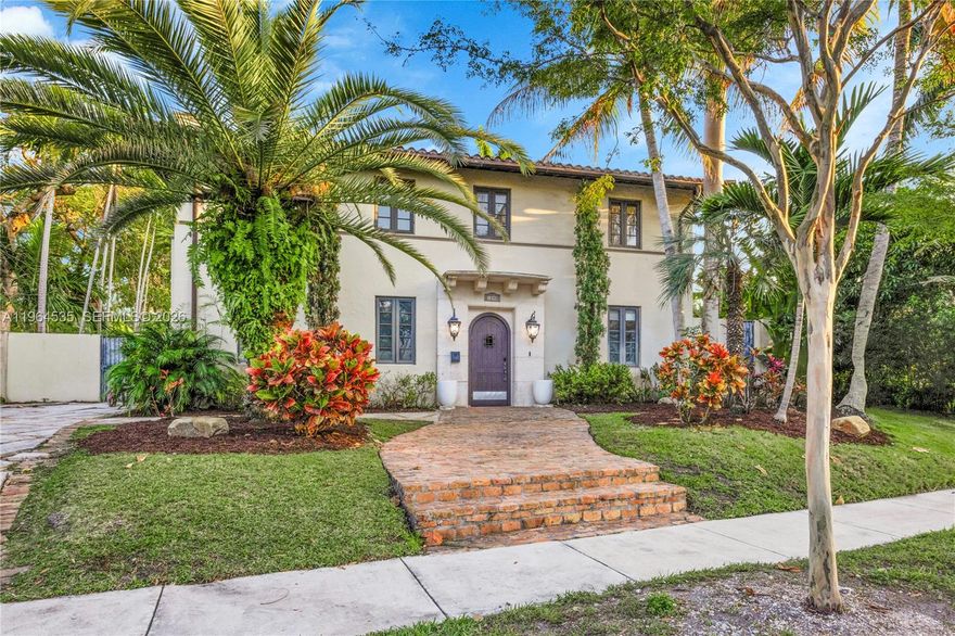 Located in the coveted neighborhood of the North Grove, this classic two-story Spanish Architecture home sits on a rare corner lot with ample sunlight. Featuring a large main living space with dedicated dining, formal living and family room all opening to backyard. The kitchen is expansive with marble counters, upgraded cabinetry and high-end subzero / wolf appliances. One bedroom ensuite is also located on this level. Upstairs features the primary suite with walk-in closet, bath and outdoor terrace. An additional ensuite with walk-in closet and bath complete this level. Additional features are the mix of stone and hardwood flooring throughout, impact windows and doors, separate laundry room and covered pool patio w/ mini kitchen & storage. Only minutes to downtown Miami and airport and walking distance to nearby Kennedy park, Vizcaya Gardens, center grove and Ransom middle school