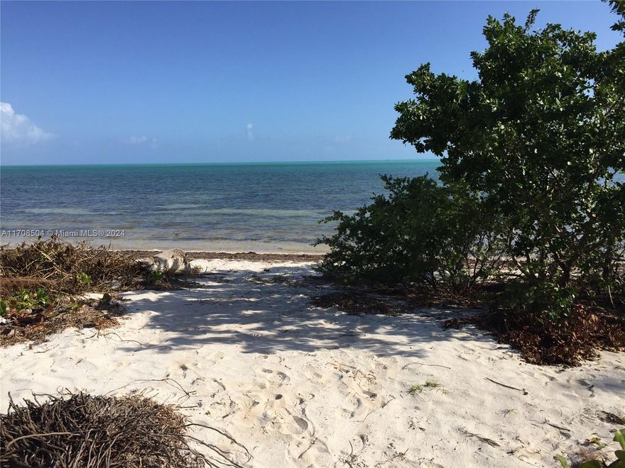 Rare opportunity to own a beachfront lot with an active building permit!  Build your dream house on this 33,680sf oceanfront lot right away or use approved plans included (one-story 2,848sf Keys style home with covered porches).  102 linear feet of ocean frontage, 326’ deep lot allowing for plenty of sandy beach for your seaside retreat!  Enjoy paddle boarding, kayaking, flats & tarpon fishing right from your backyard, bike rides to nearby Long Key State Park or world-class diving & fishing.