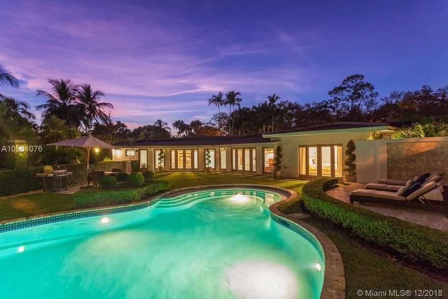 Hollywood glamorous, Palm Beach sophisticated, and South Florida warm and inviting best describes the ambiance of this stand-out residence, completely re-designed and restored to perfection by famed New York designers. Fall in love w/ elegant formal living & dining rooms, an enchanting poolside family room, MiaCucina bistro-style chef's kitchen, distinguished library/office, metropolitan chic bedrooms & baths, and CGI impact resistant windows & doors. Step outside into a private oasis filled w/ exotic palms & flora, divine swimming pool & lounge area, beautiful meditation garden, and glorious ½ acre paradise. This one-of-kind home in Coral Gables' illustrious 'Golden Triangle' is truly inspirational, and will suit the needs & desires of the most discerning Buyer.