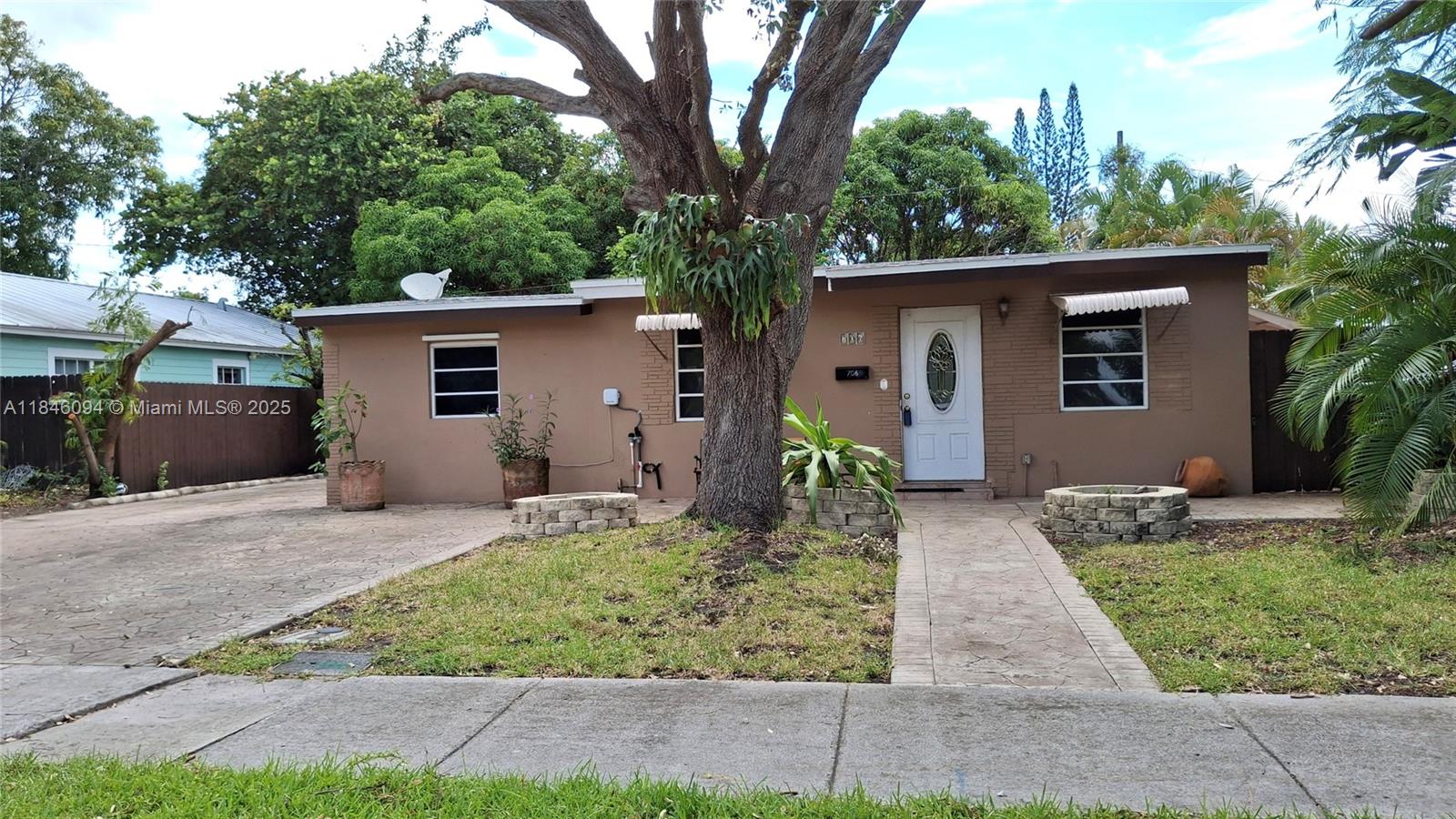 Charming cottage in the heart of Pompano Beach. 3/1 plus a den/sitting room/office, mango & star fruit trees, large covered patio, shed, tiled throughout, plenty of parking, RV & boats welcome!! Quiet neighborhood. A new entertainment/dining center is developed nearby. Up & coming area.