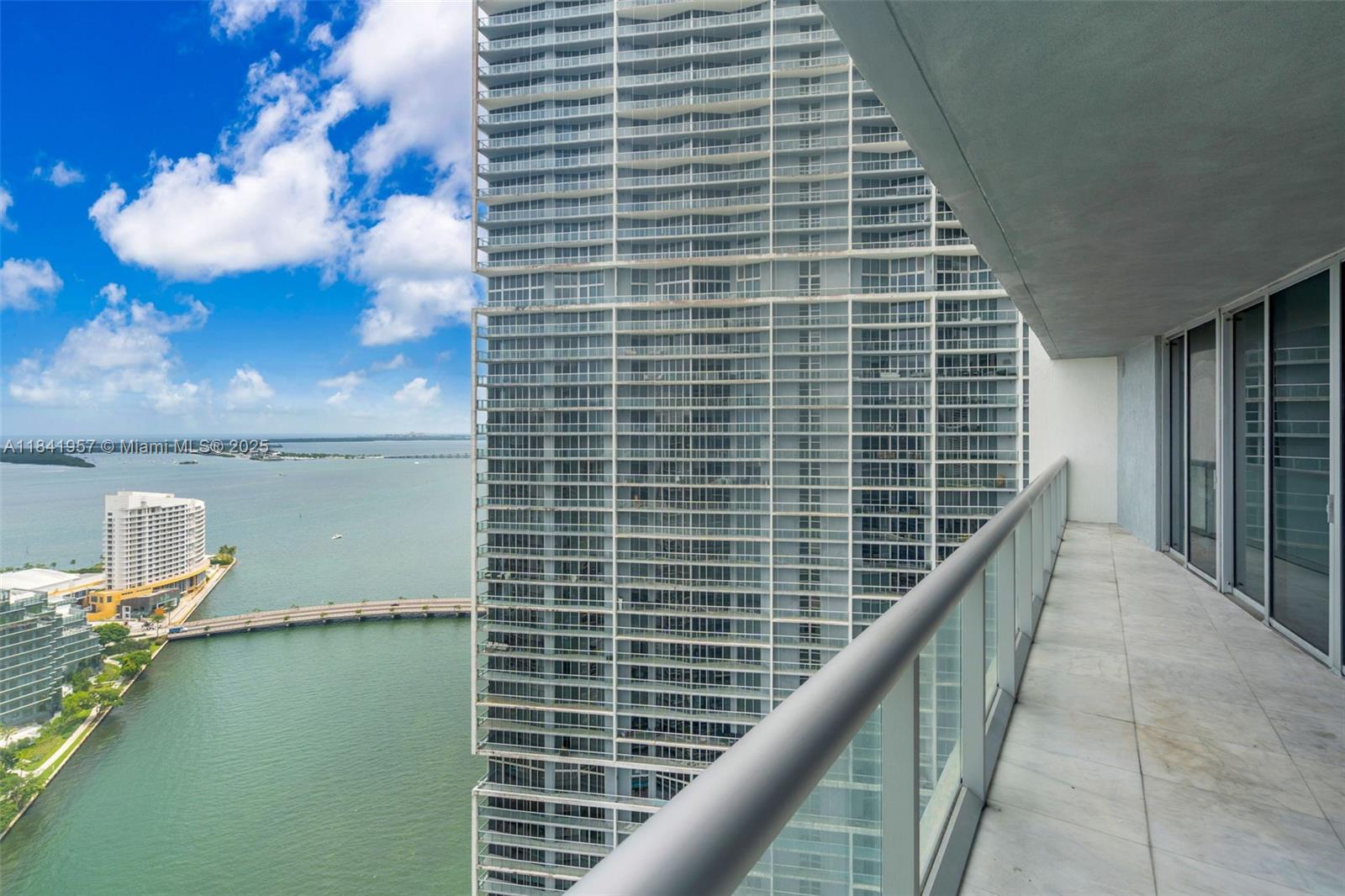 Enjoy breathtaking views of Brickell Key and Biscayne Bay from this spacious 35th-floor residence at Icon, Brickell, located next to the luxurious W Miami 5-star resort. This unit offers a split 2-bedroom + den floor plan, marble floors in the living area, wood floors in the bedrooms, and a fully equipped kitchen. The full-service building provides 24-hour concierge, valet, and security. Amenities include a massive lap pool (once the longest in the world), multiple restaurants, a movie theater, an award-winning spa, a state-of-the-art fitness center, a spinning room, lounges, a nightclub, billiards and community rooms, and more!Parking on the 5th floor-the lowest level.Experience urban living at its finest with easy access to major highways, Brickell City Centre, and public transportation.