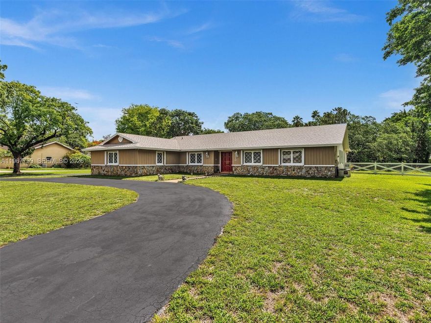 Come see this home with so many possibilities!  There are 2 homes on this oversized 1+ acre lot. The main home features 5 bedrooms/2.5 bathrooms, large rooms, formal dining room, spacious eat in kitchen with an over abundance of cabinet space overlooking the family room AND an oversized recreation room. More interior features are a split bedroom plan, wood beams, gorgeous rock walls, interior laundry room, fireplace, large eat in kitchen overlooking the family room, double door entry into the home.   The 2nd home has 2 bedrooms, 1 bath, screened in patio and a carport for 2 cars. Large circular driveway that can hold at least 15+ cars.  Room for your boat and your RV.  Upgraded electric for a generator, This is a great oldie but goodie home with so many opportunities. It can definitely become a great multi-generation home or even an ALF facility with the proper city/county/state approval.  The owners have pride of ownership which you will observe and is located in a beautiful neighborhood that is close to shopping, easy access to major highways and more.