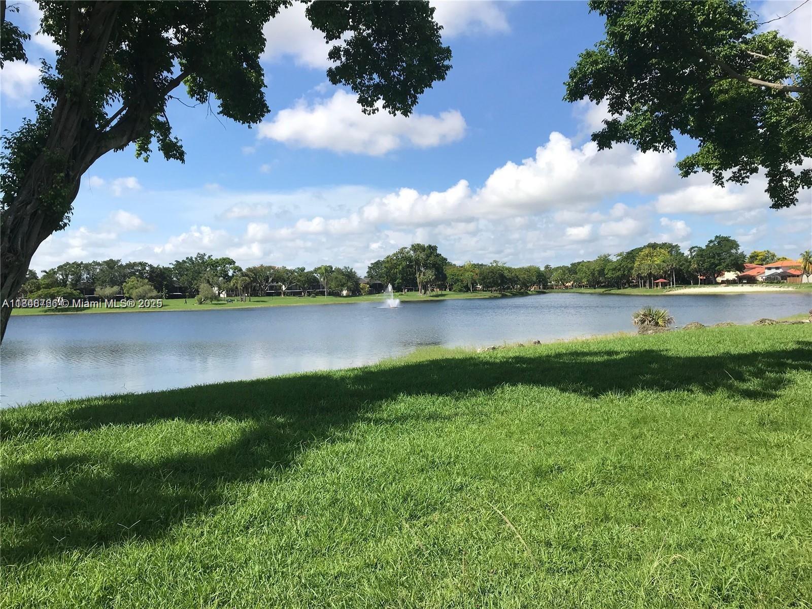 Beautiful 2 bedroom, 1.5 bath unit on the ground floor in Hammock Trails. This condo unit is one of the best units in the Hammocks for rent. This is a super clean unit with tile floors throughout. Very nice nice kitchen area with gas stove, new like appliances. Washer and dryer included in the unit. Hammock Trails has a tranquil lake with walking paths and an amazing pool area. Landlord has stated that the water bill is $50 dollars a quarter.. Call today to see the unit, very easy to see.