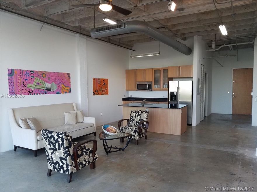Unique Industrial New York Style Loft located in the Upper East Side of Miami.  Floor to ceiling windows to enjoy the beautiful Miami Beach skyline.  Granite kitchen counter tops, island and stainless steel appliances. Bathroom has floating granite counter top vanity and full bathtub. Polish concrete floors throughout the main area of the loft.  Washer/dryer located in the unit.  Building has hot tub, gym and allows two pets.  One assigned parking space in the secure parking garage.  Secure building with card entry access and tel-entry system for your guests.  Building was originally the Miami National Bank and was built in 1956 by Smith&Korach architects.  Since then it has gone through additions and updates.  This is part of Miami history 1950's emerging 79th & Biscayne MIMO Intersection