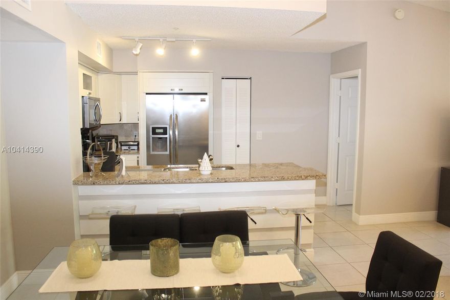 If you want updated, look no further. This home is beautifully upgraded with new kitchen cabinets, appliances, granite countertops in kitchen and baths, tile flooring throughout, and cathedral ceilings. Conveniently located next to the community entrance and across from the clubhouse and pool, fun is steps away. This community features a gated entry, security, workout facility, tennis, racquetball, volleyball, heated pool, clubhouse and much more. Ail within less than 5 minutes to I-75, Turnpike extension, Pembroke Lakes Mall and so much more!!