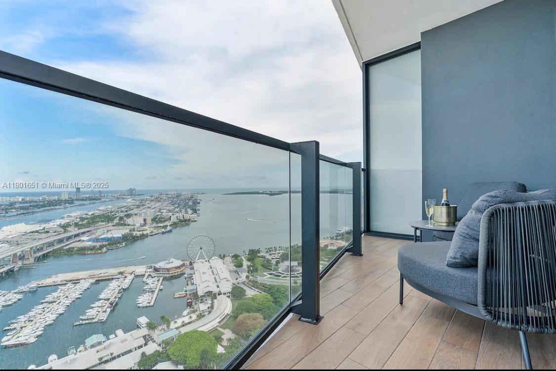 Welcome to elevated living at The Elser Hotel & Residences. This fully furnished 2-bed, 2-bath corner unit offers direct Bay and skyline views, designer interiors, an Italian kitchen with quartz countertops, custom cabinetry, and in-unit washer/dryer. Enjoy 5-star amenities: rooftop resort-style pool, spa, state-of-the-art fitness center, LED screening wall, sky lounge, coworking lab, cocktail bar by Jaguar Sun, EV charging stations, and 24/7 secure building access. Enjoy smart living with a custom resident app for keyless living, concierge services, delivery tracking, and more. Steps from Kaseya Center and Bayside. Live where luxury meets lifestyle.